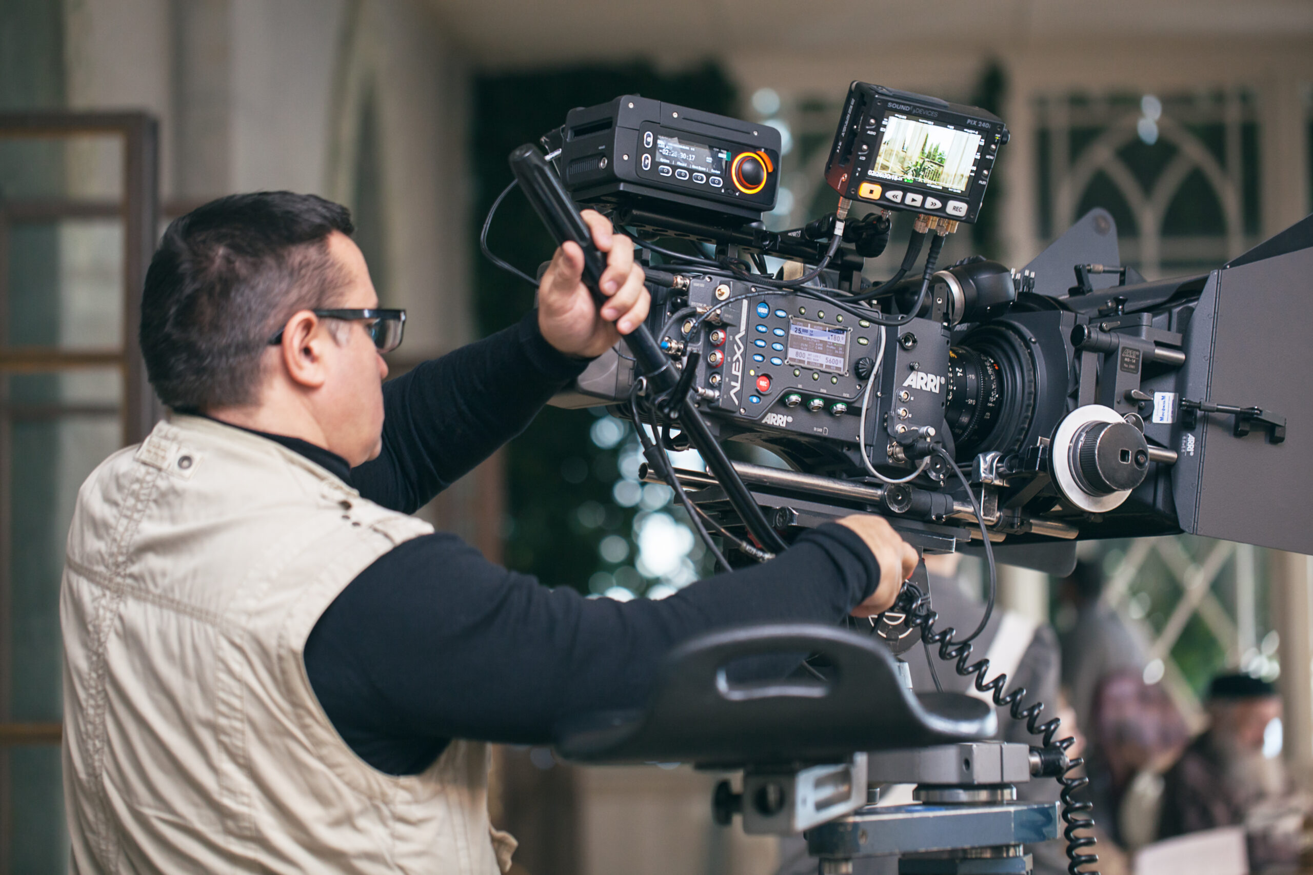 MOSCOW, RUSSIA - DECEMBER 9, 2014:  Professional cameraman working with modern equipment during filming of Not Yet Evening by Marlen Khutsiev