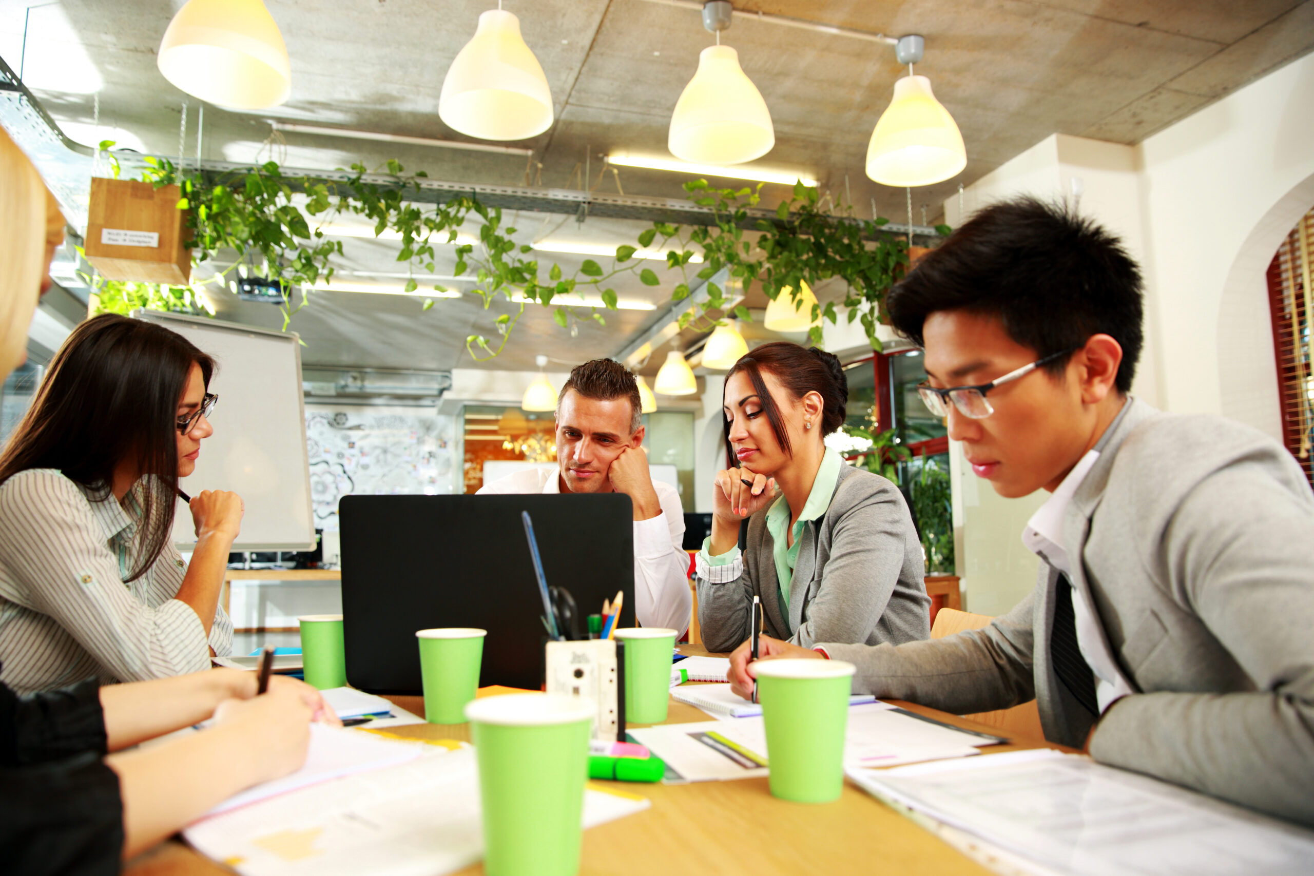 Business people having meeting around table in office